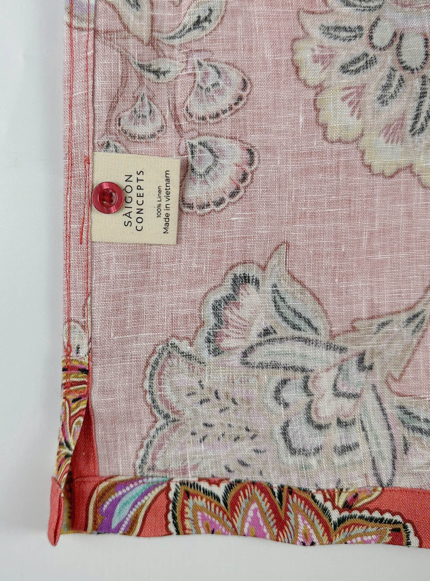 care label and inside stitching detail of linen shirt