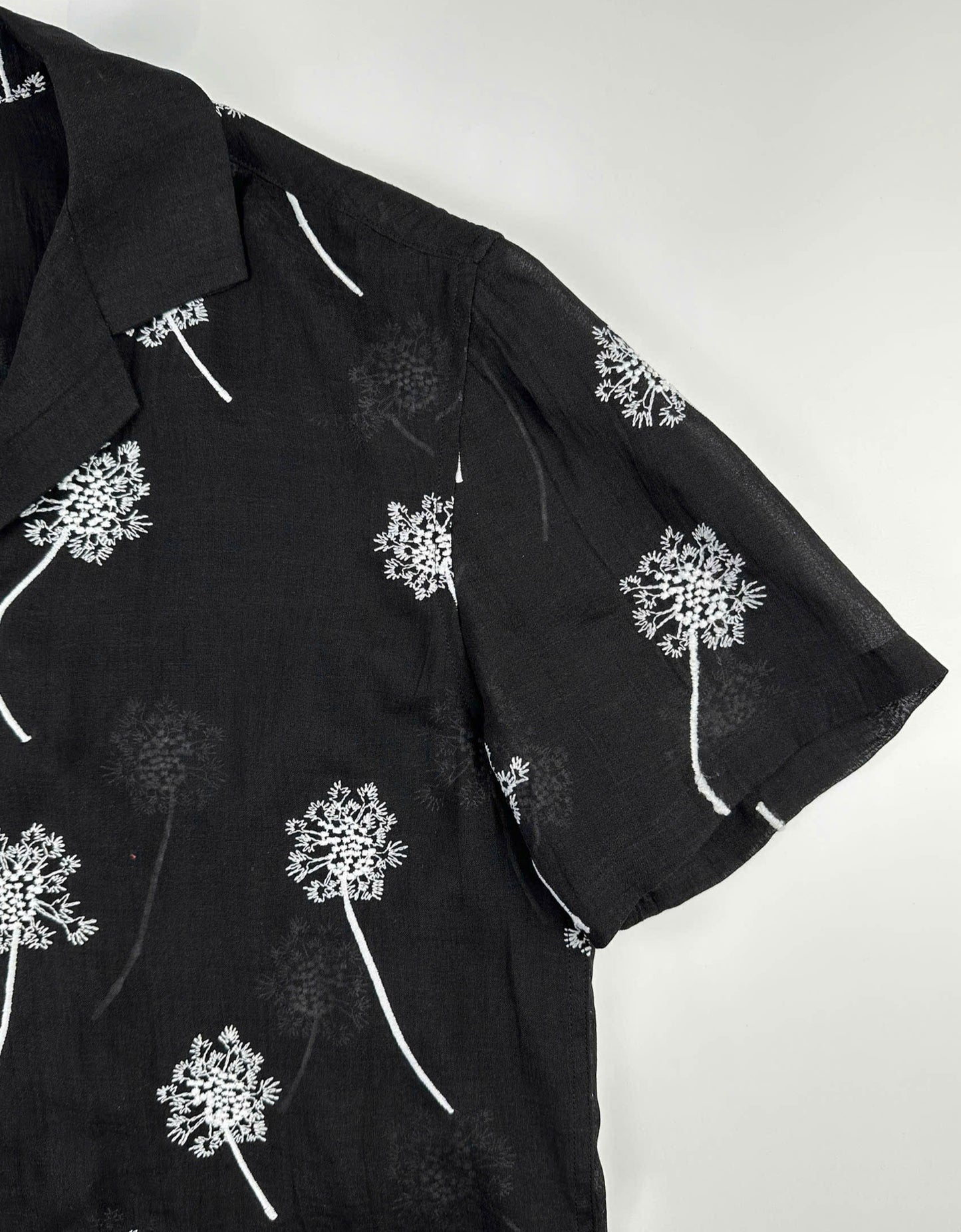 Black sheer linen shirt with white dandelion embroidery