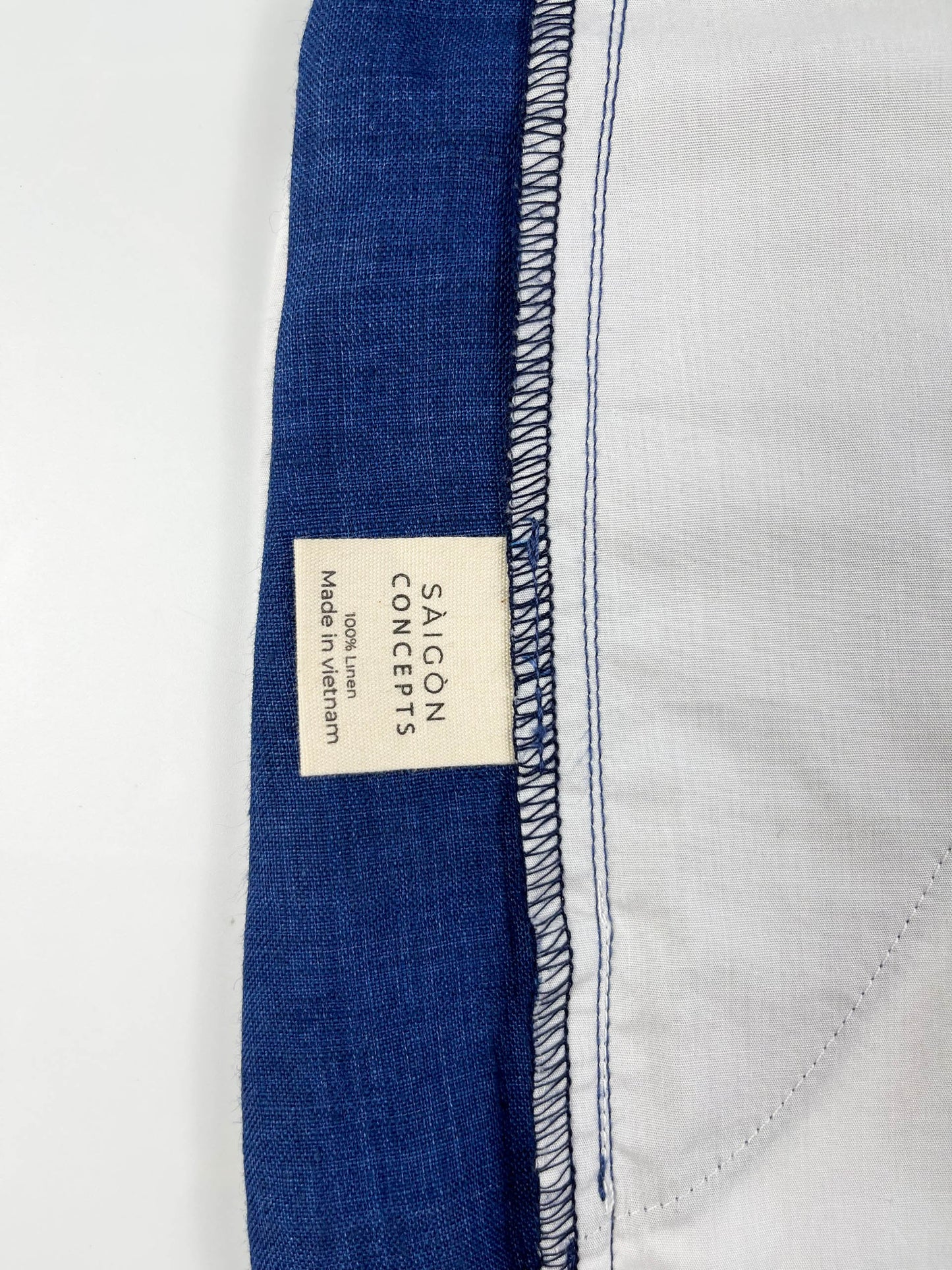 Saigon Concepts Mid-Blue linen wide leg coastal pants - inside care label detail view