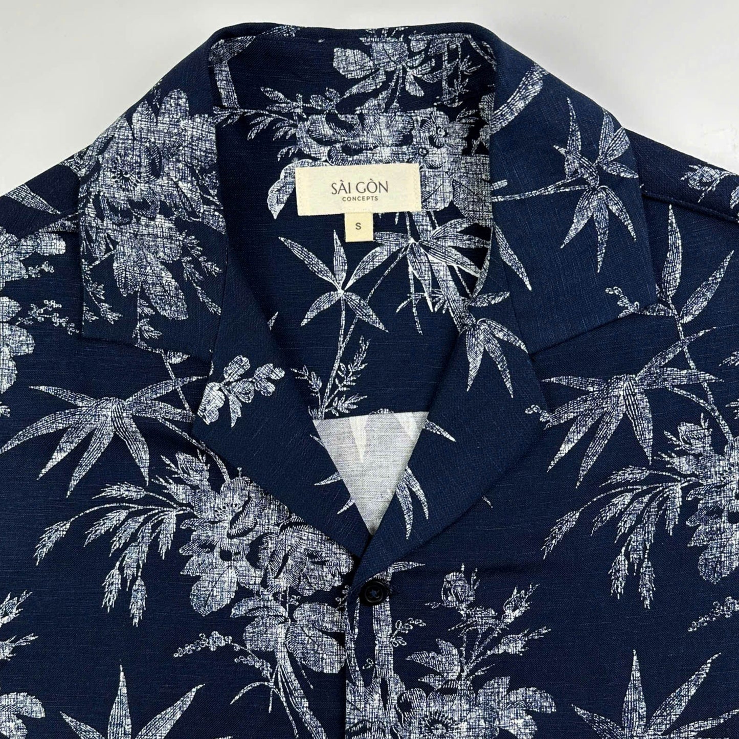 Navy linen Hawaiian shirt with white bamboo and blossom print