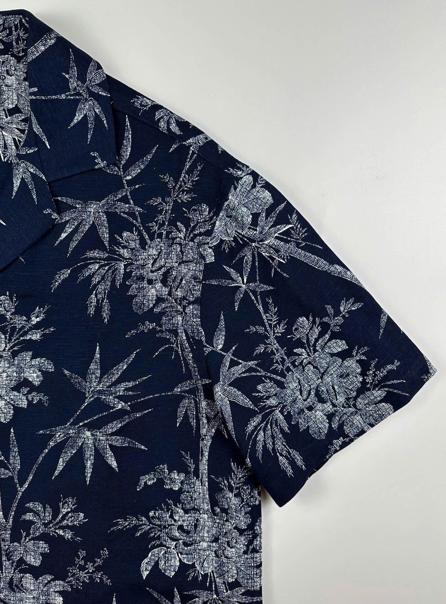 Close up sleeve detail - Navy linen Hawaiian shirt with white bamboo and blossom print