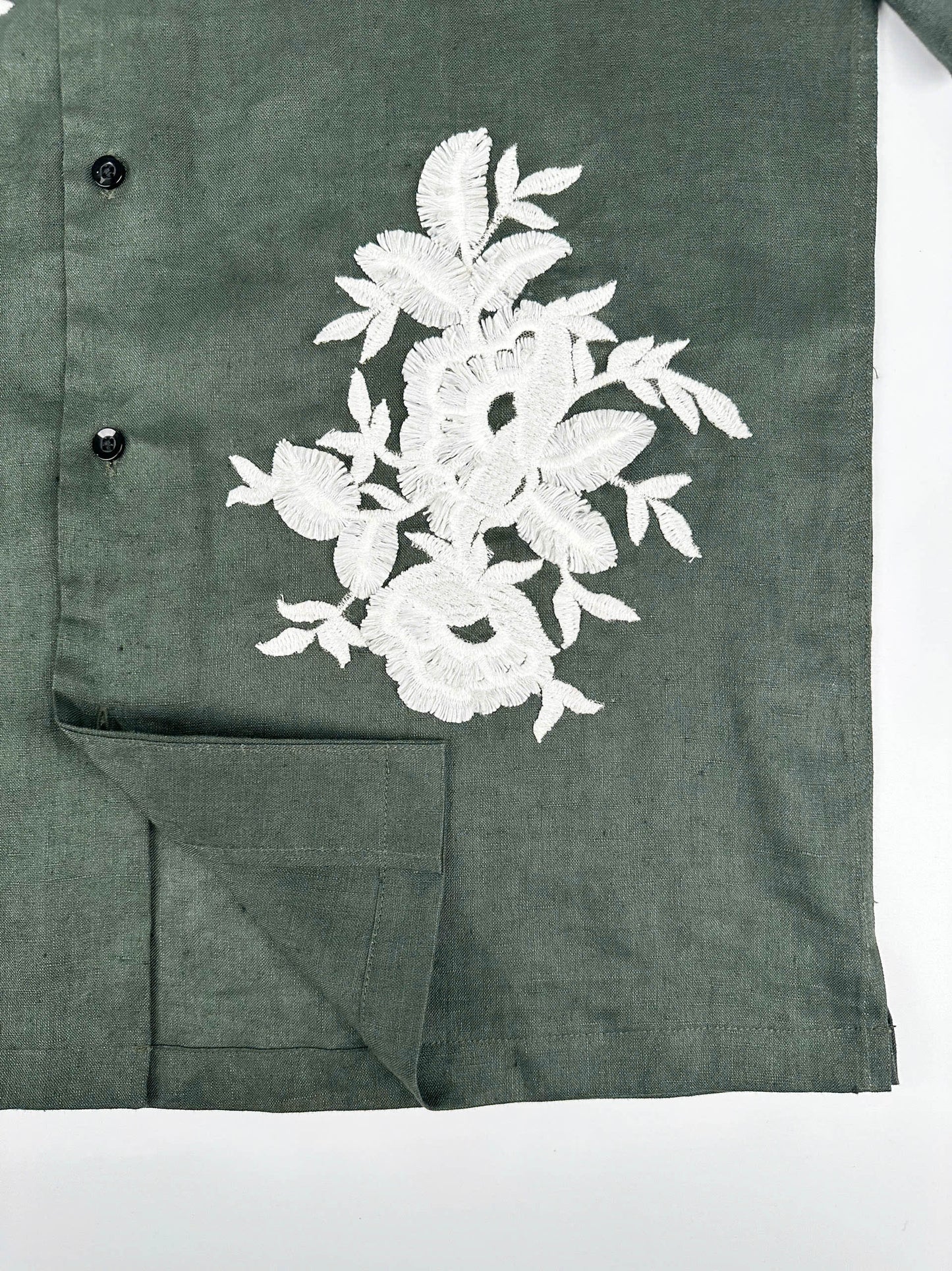 Saigon Concepts Deep Army Green Hawaiian Linen shirt with white floral lace on a light grey background - front seam detail