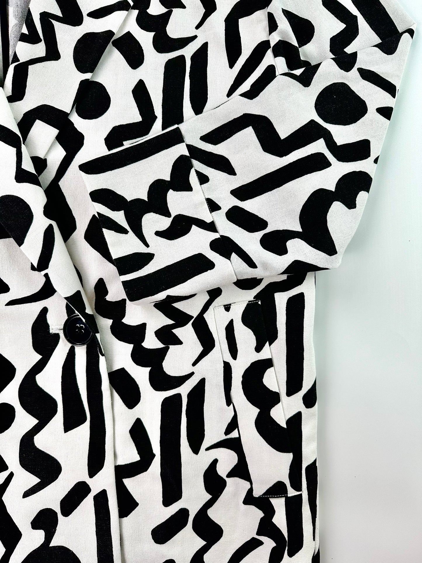 Saigon Concepts Black and white Urban Canvas patterned jacket on a light grey background - sleeve and pocket detail view