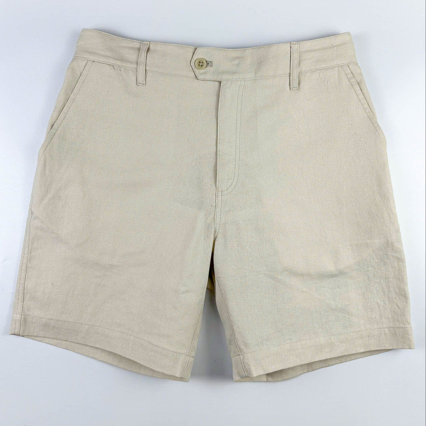 Sand coloured shorts on a white background