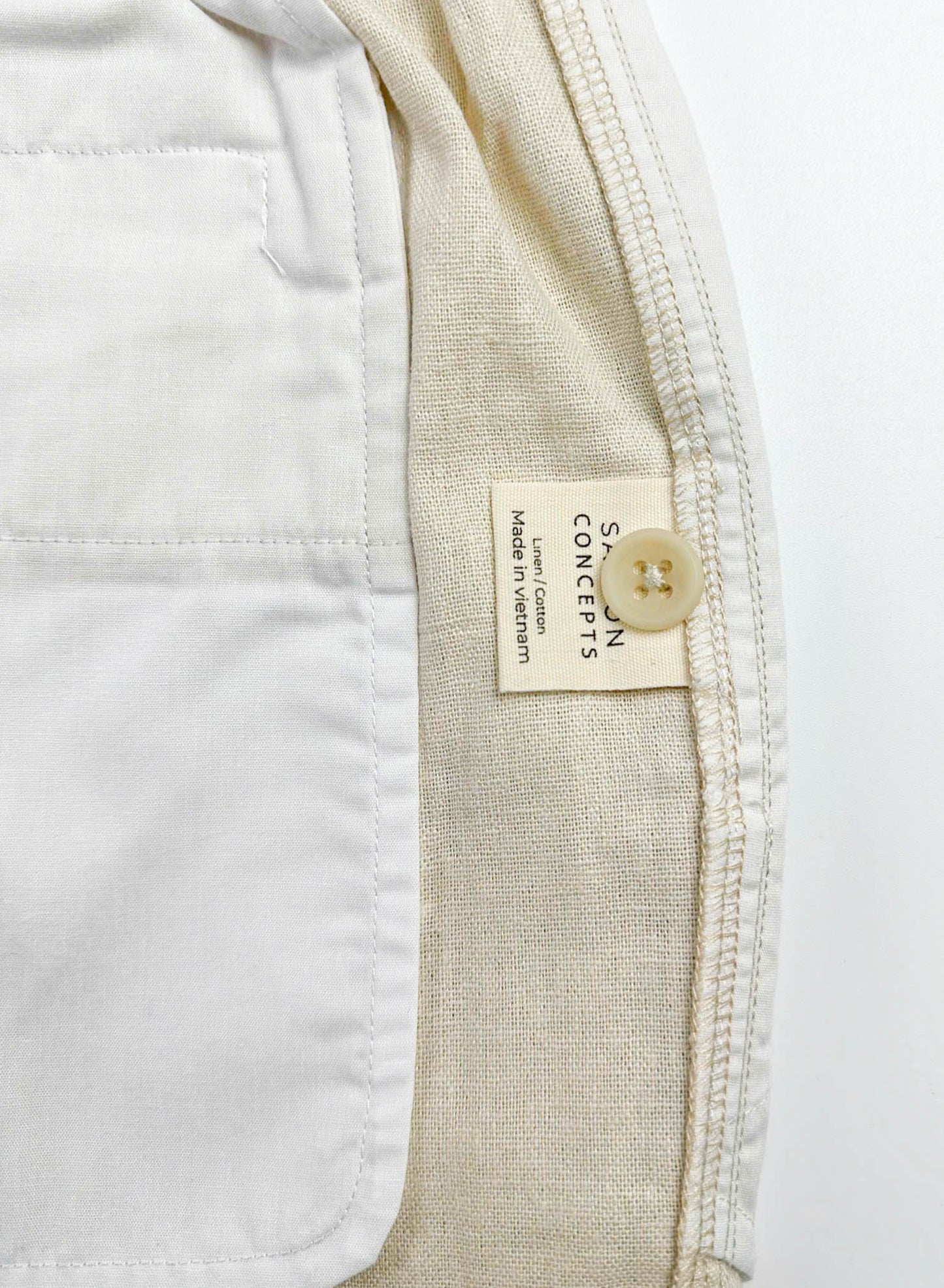 Shorts close-up care label detail with spare button