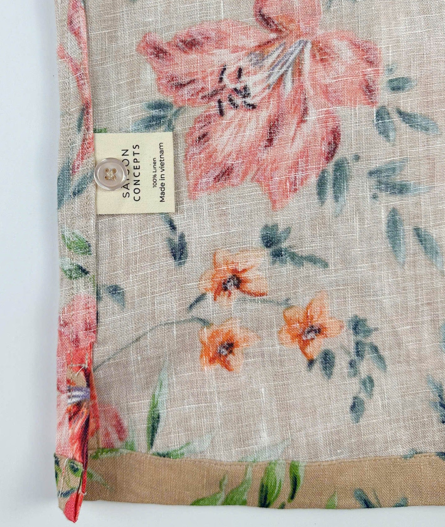 Care Label & inside detail - Vibrant Floral patterned linen Hawaiian style shirt on a sandy beige background