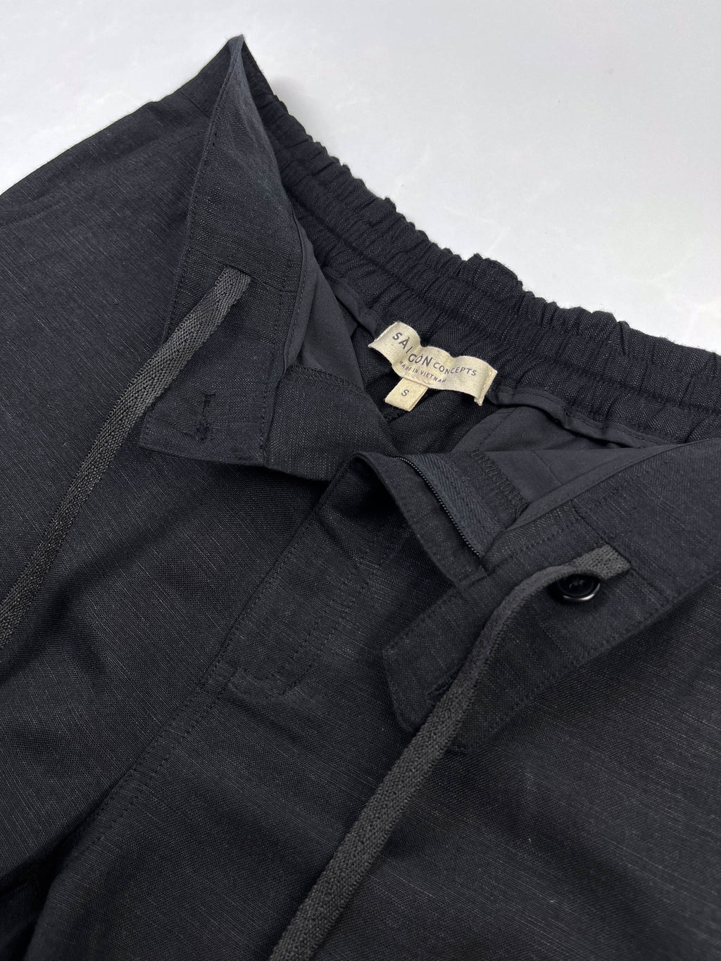 Front view of inside draw string detail on black Linen Cotton Riviera Shorts - Saigon Concepts