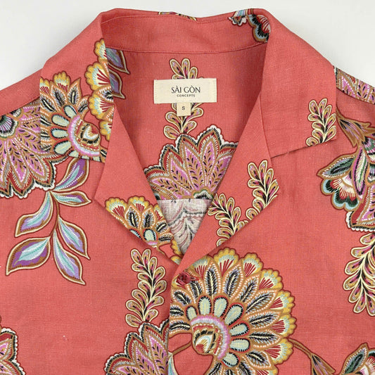 Coral coloured Hawaiian shirt with vibrant batik-style lotus and floral print
