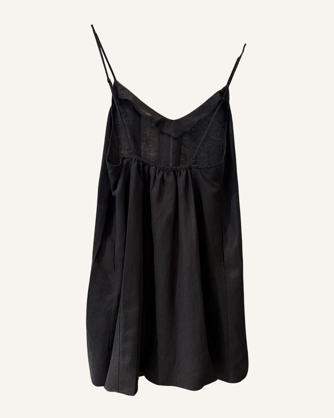 Black linen cami slip dress on a white background
