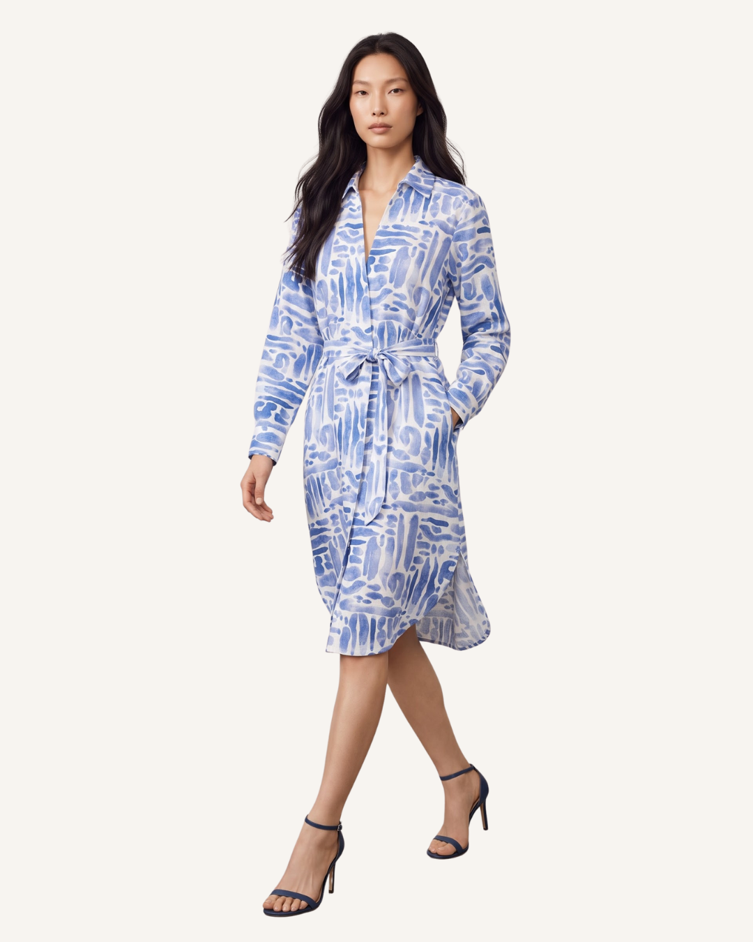 Capri Blue printed belted midi dress with V-neck and long sleeves on female model, full front view.