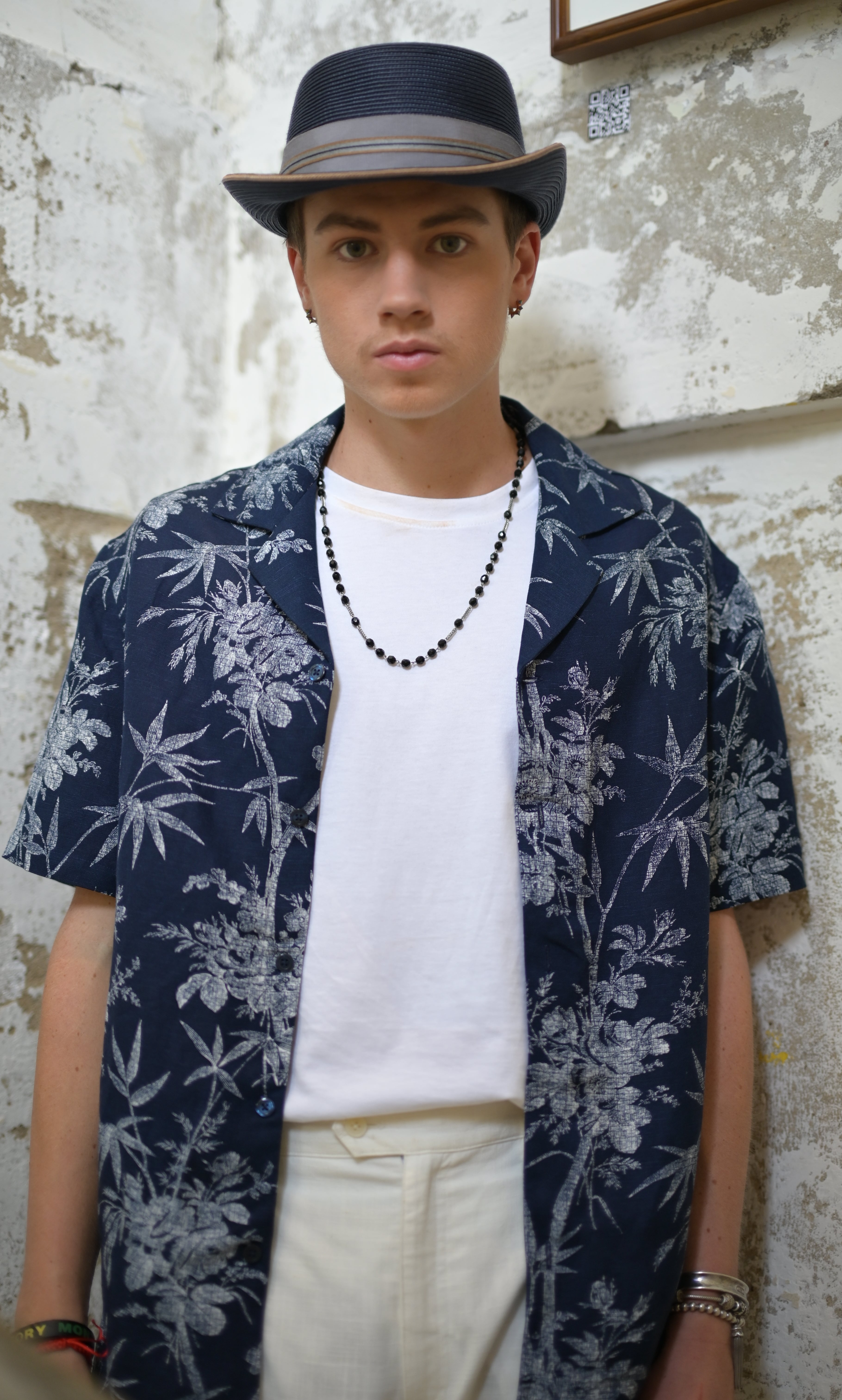 Model wearing Navy & White Hawaiian Shirt open with White Tee and White Linen Pants