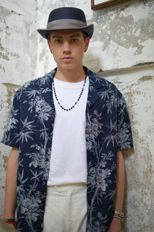 Model wearing Navy & White Hawaiian Shirt open with White Tee and White Linen Pants