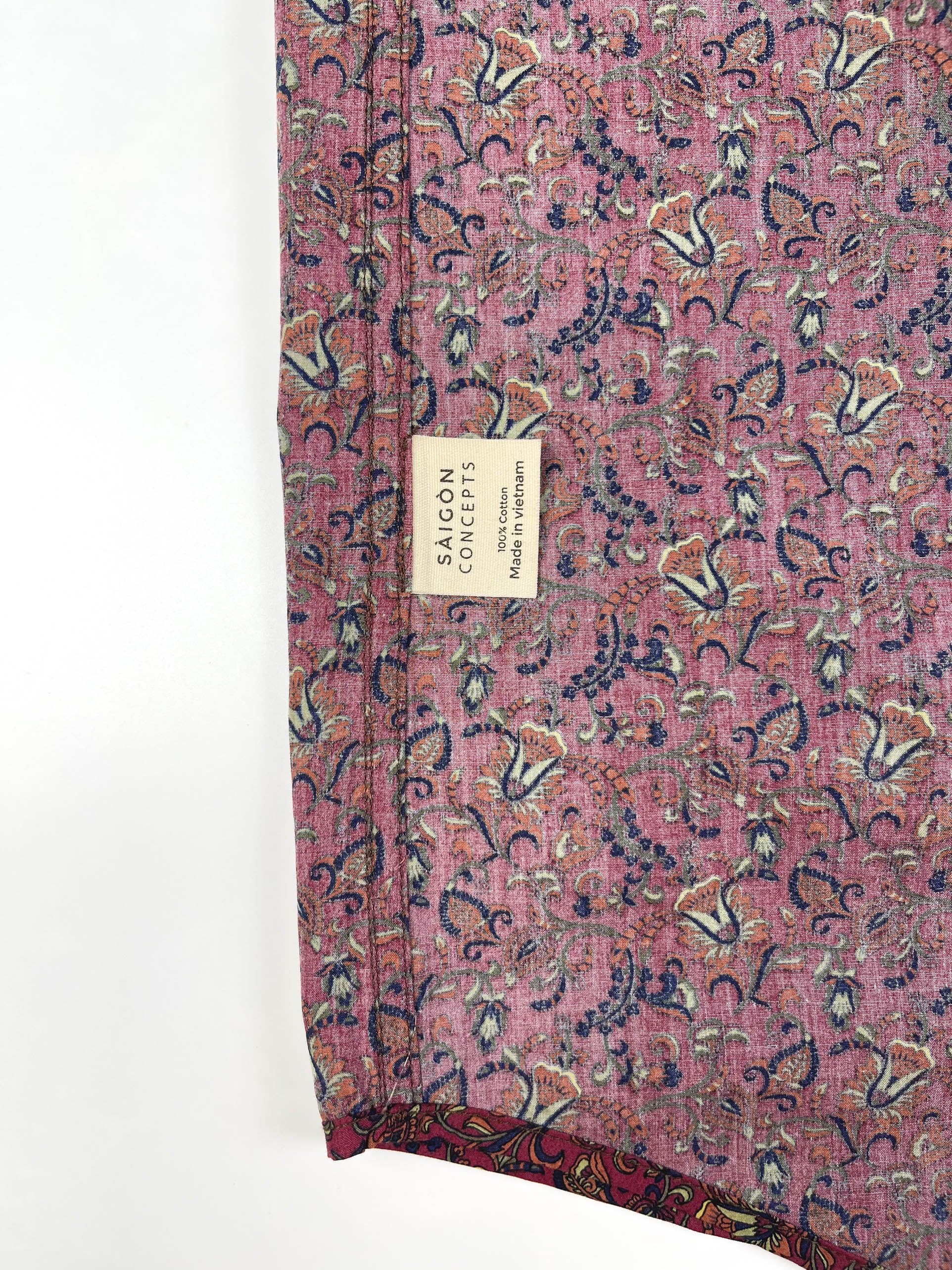 Crimson Vines cotton short sleeve button-up shirt lay flat inside care label view, crimson with detailed vine floral print