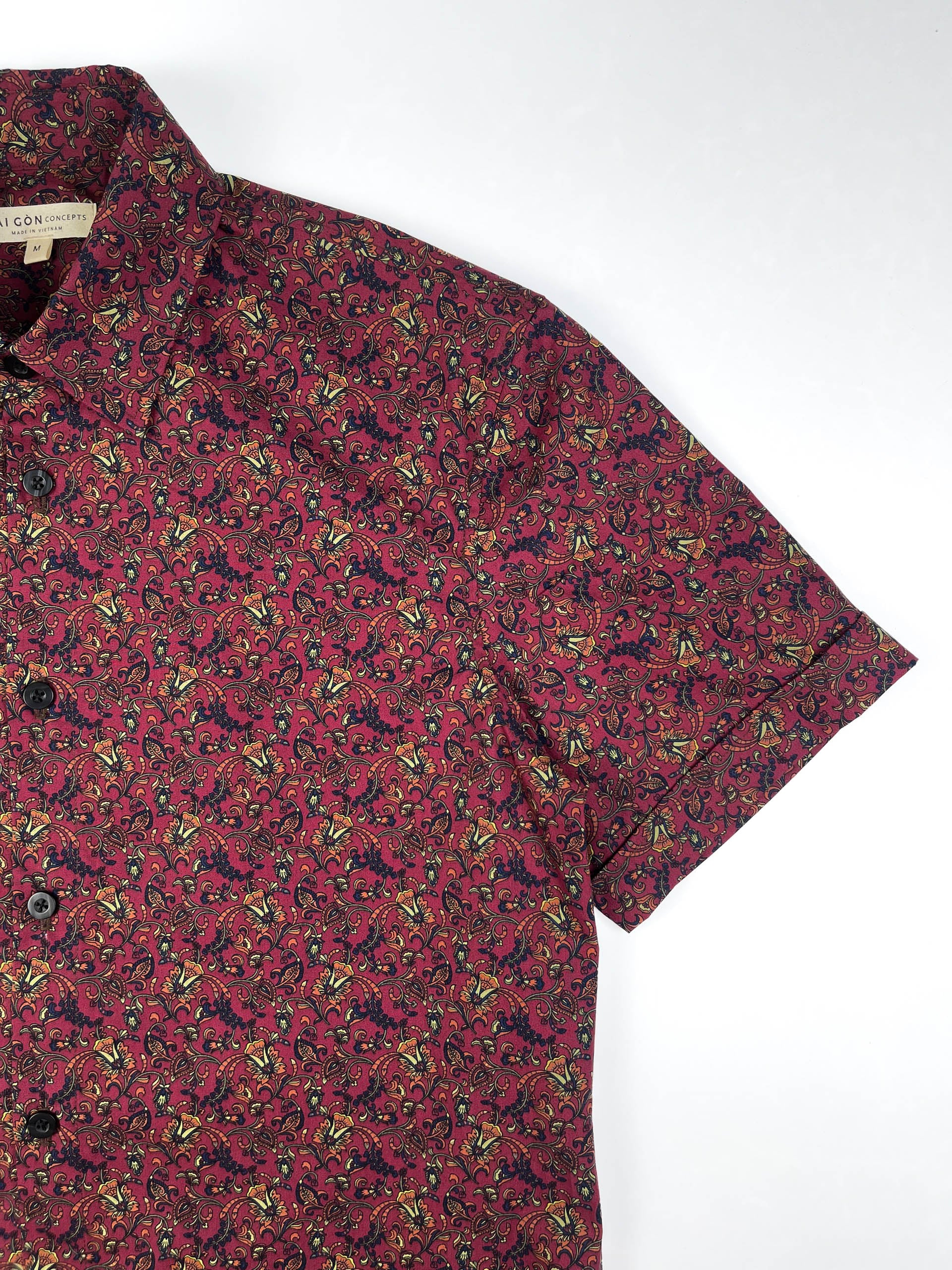 Crimson Vines cotton short sleeve button-up shirt lay flat sleeve detail view, crimson with detailed vine floral print