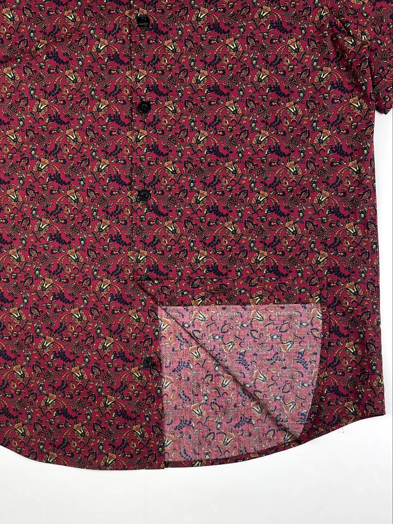 Crimson Vines cotton short sleeve button-up shirt lay flat inside seam detail view, crimson with vine floral print