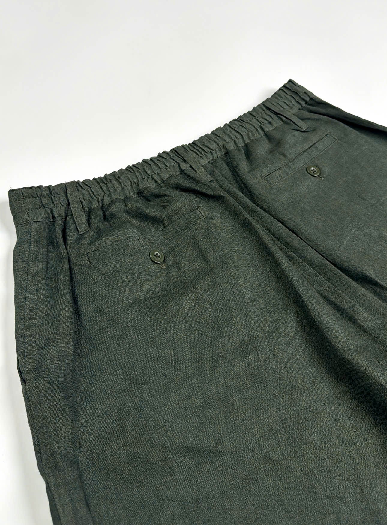 Dark Green Army coloured Riviera Linen Shorts - flat back view of elasticated waistband and back pockets - Saigon Concepts
