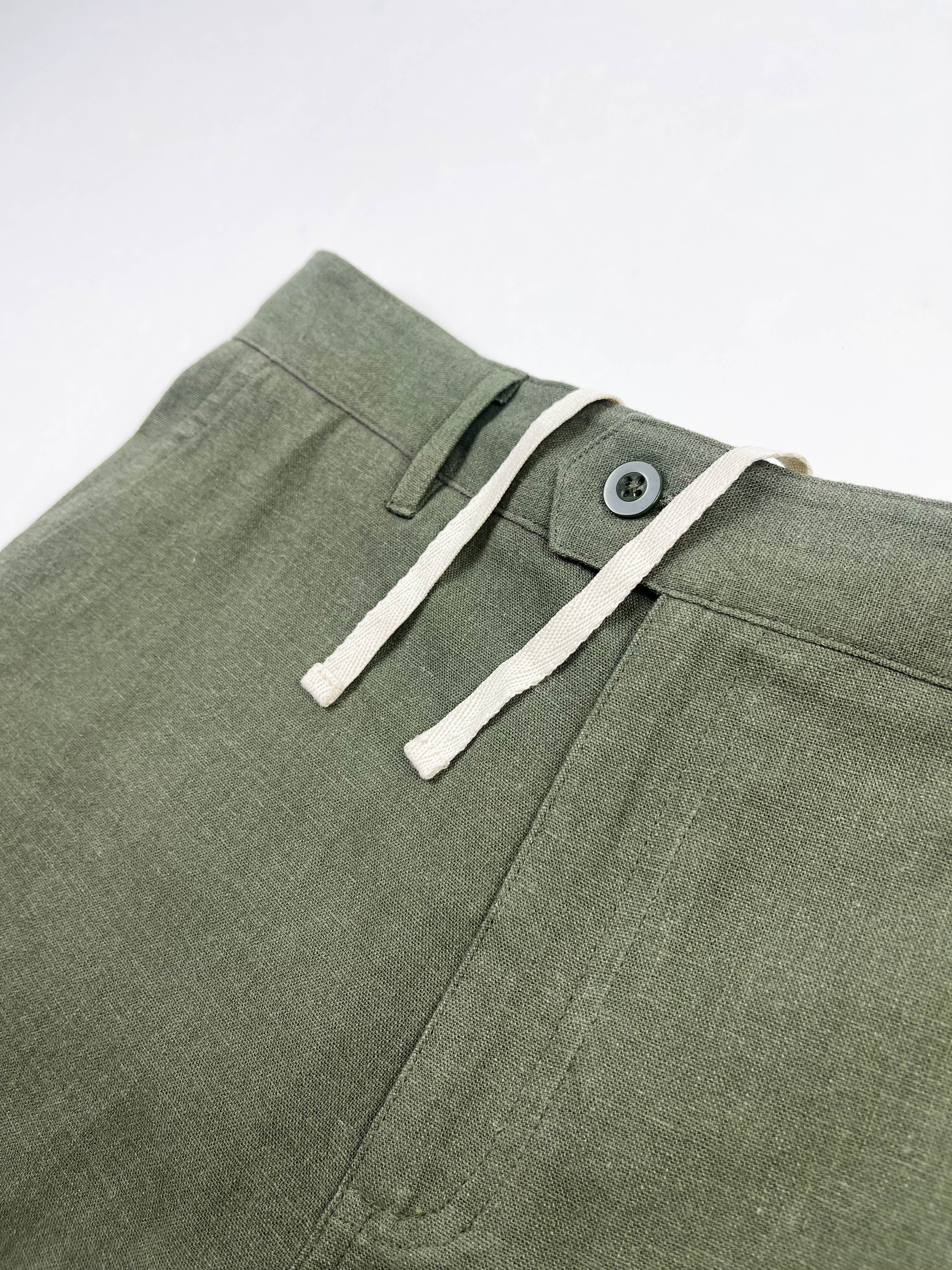 Front detail of Army Green linen Riviera Shorts, button closure and drawstring – Saigon Concepts
