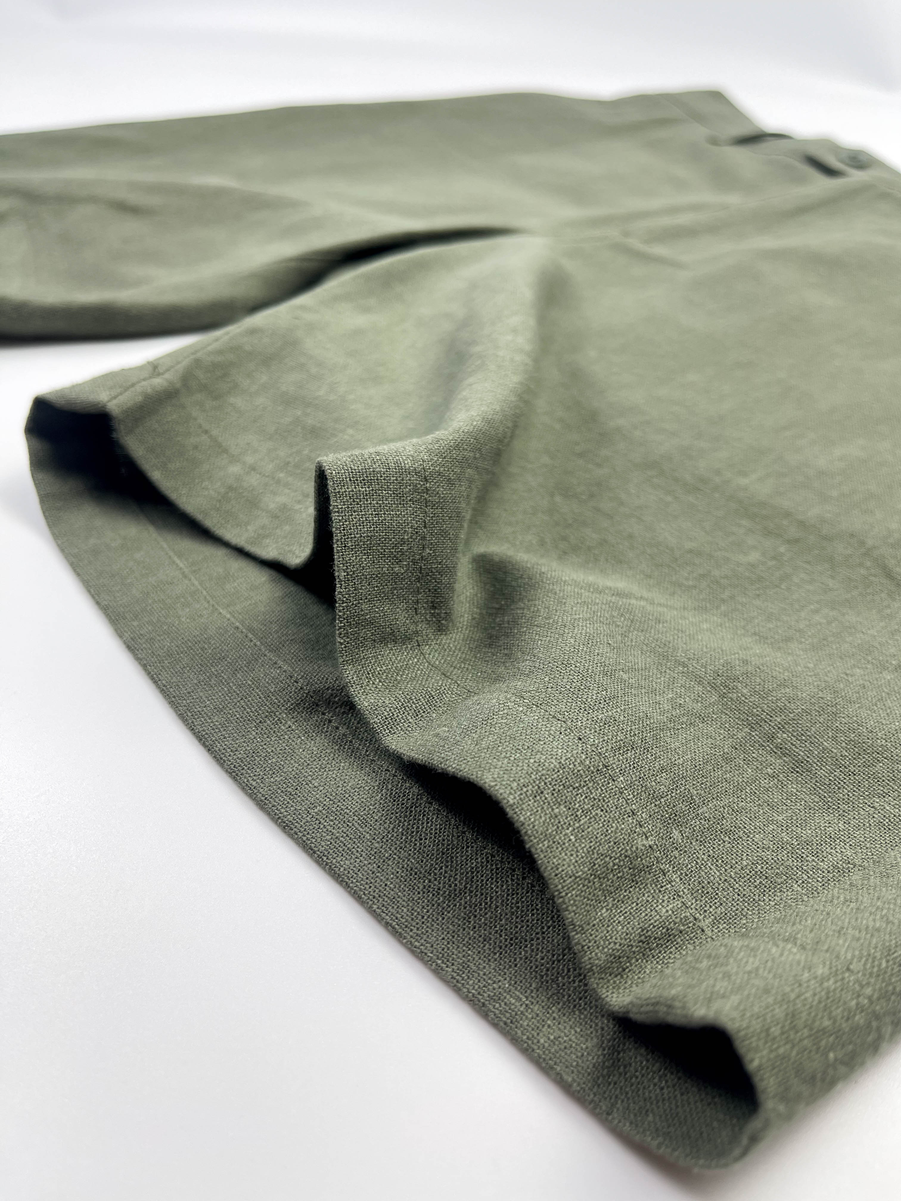 Leg side seam detail of army green linen Riviera Shorts – Saigon Concepts