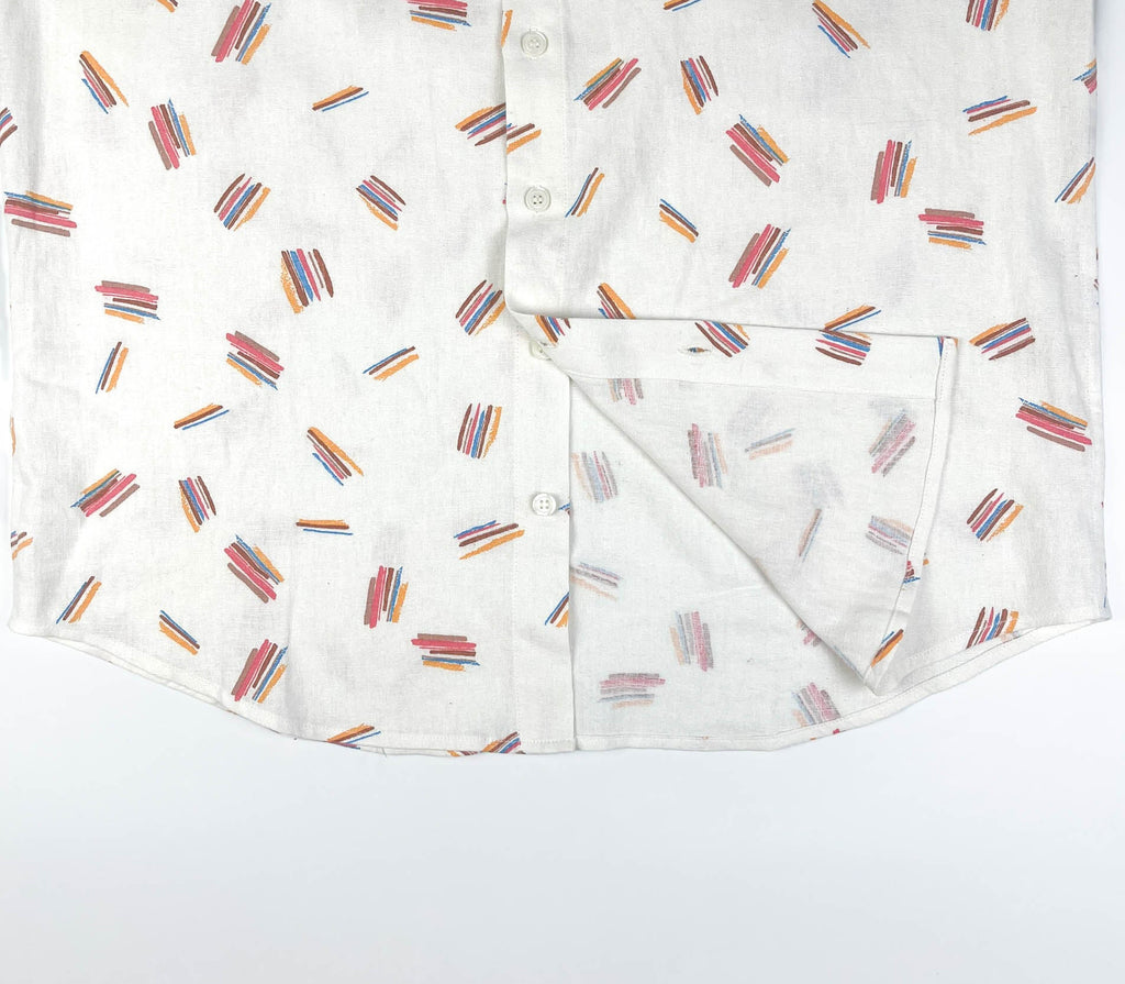 Crayon Strokes on natural white linen fabric, button-up shirt lay flat inside seam detail view