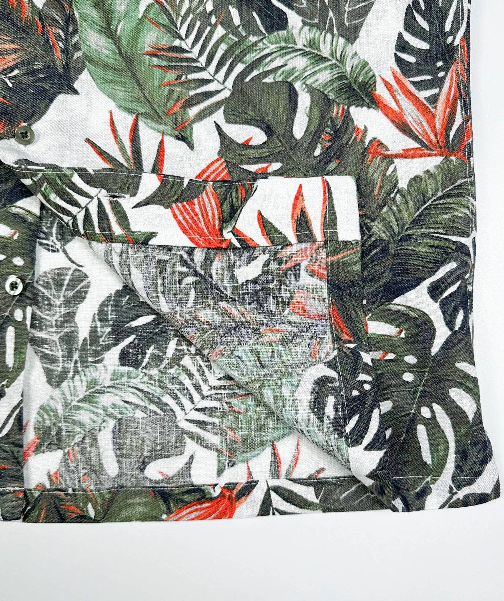 Saigon Concepts Fire & Fern Hawaiian Shirt - tropical jungle print with monstera ferns and bird of paradise florals on natural white linen - inside edge detail view