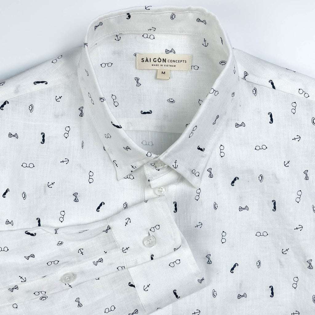 Gentlemen Club linen long sleeve button-up shirt lay flat neck detail view, minimalist print on white linen
