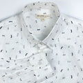 Gentlemen Club linen long sleeve button-up shirt lay flat neck detail view, minimalist print on white linen