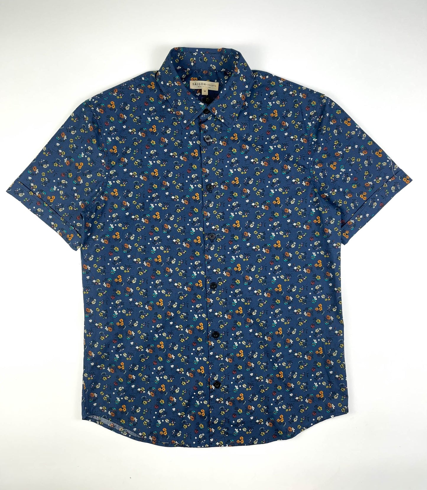 Indigo Meadow cotton short sleeve button-up shirt lay flat full front, meadow floral print on indigo base fabric