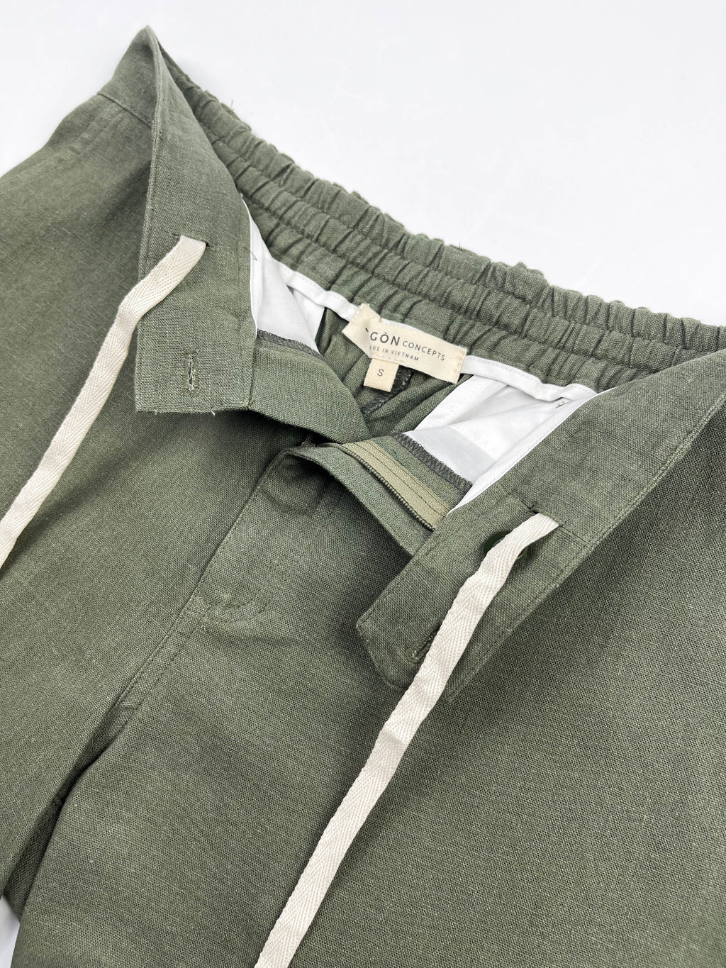 Inside front drawstring view of army green linen riviera shorts - Saigon Concepts