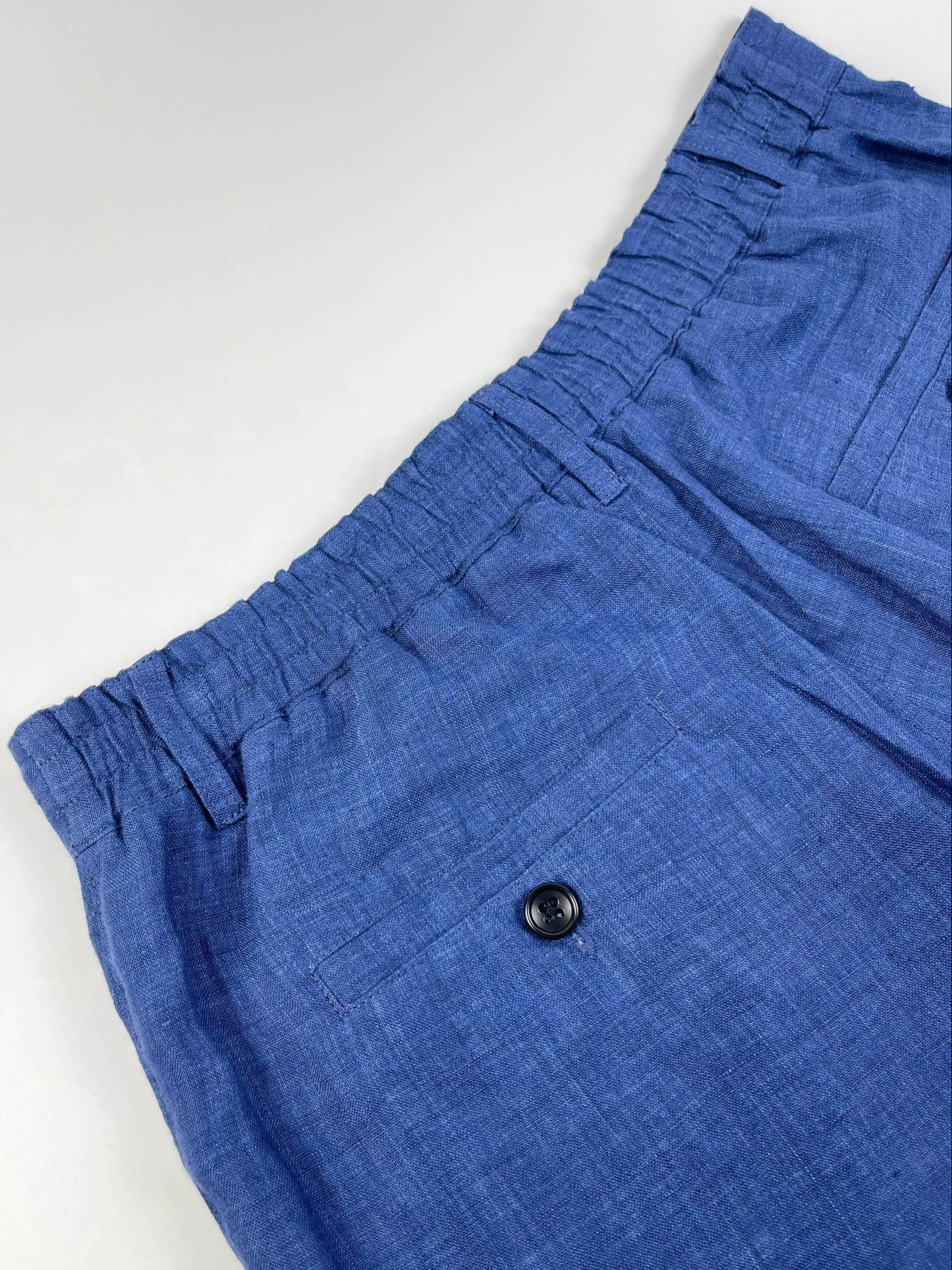 Saigon Concepts Mid-Blue linen wide leg coastal pants - lay flat view of backside elasticated waistband and pocket detail