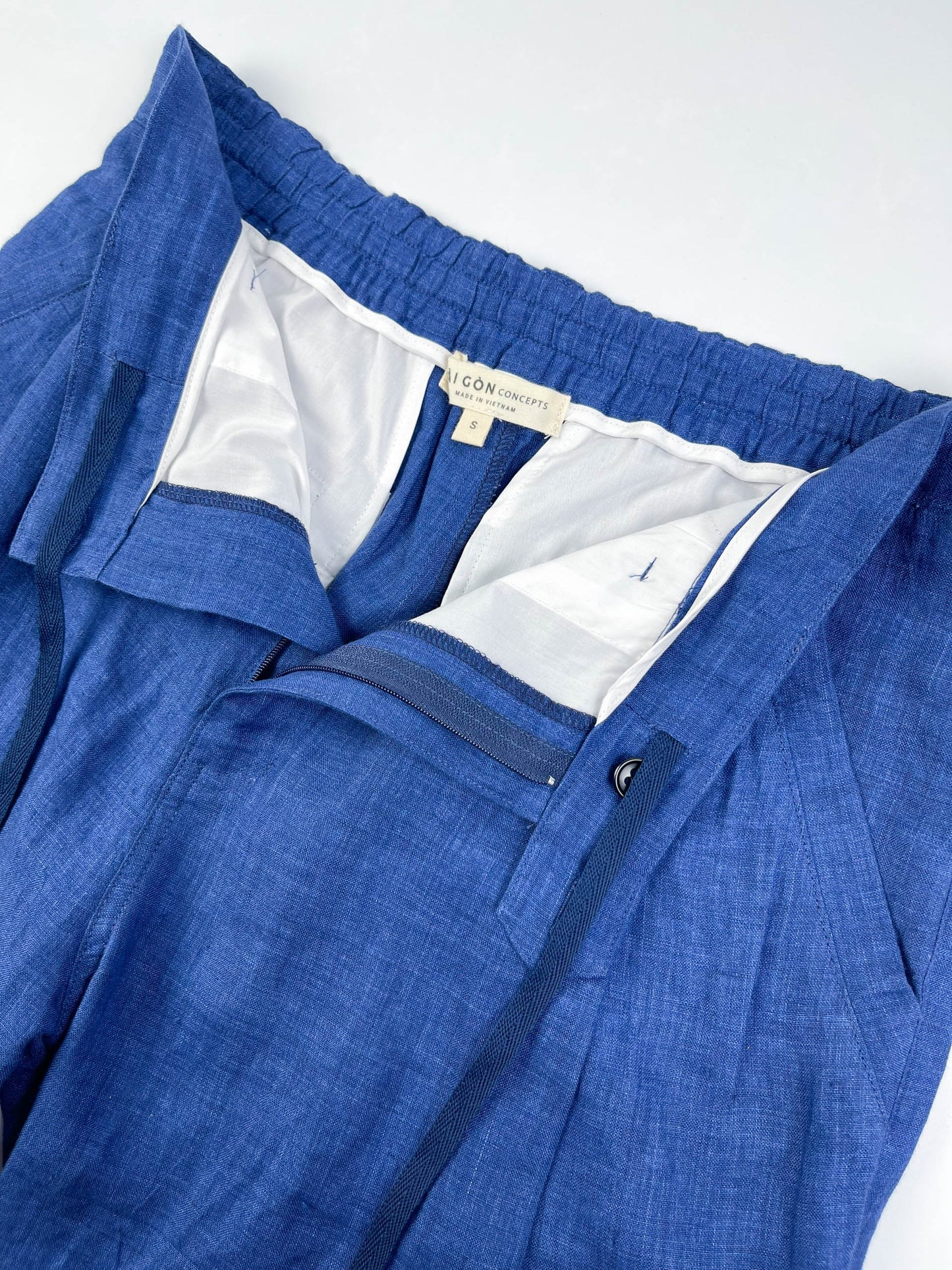Saigon Concepts Mid-Blue linen wide leg coastal pants - lay flat view of front inside detail with drawcord detail