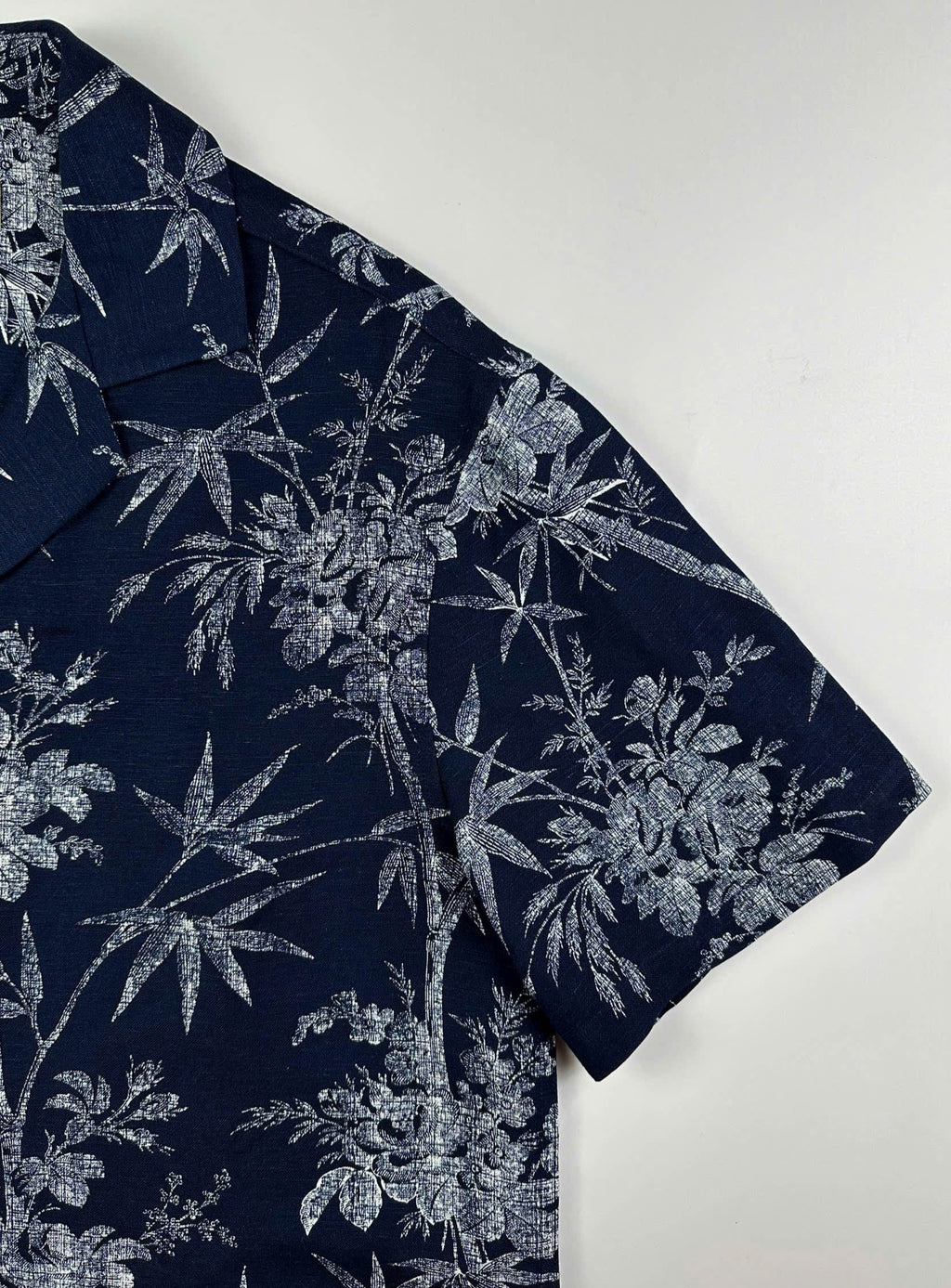 Close up sleeve detail - Navy linen Hawaiian shirt with white bamboo and blossom print