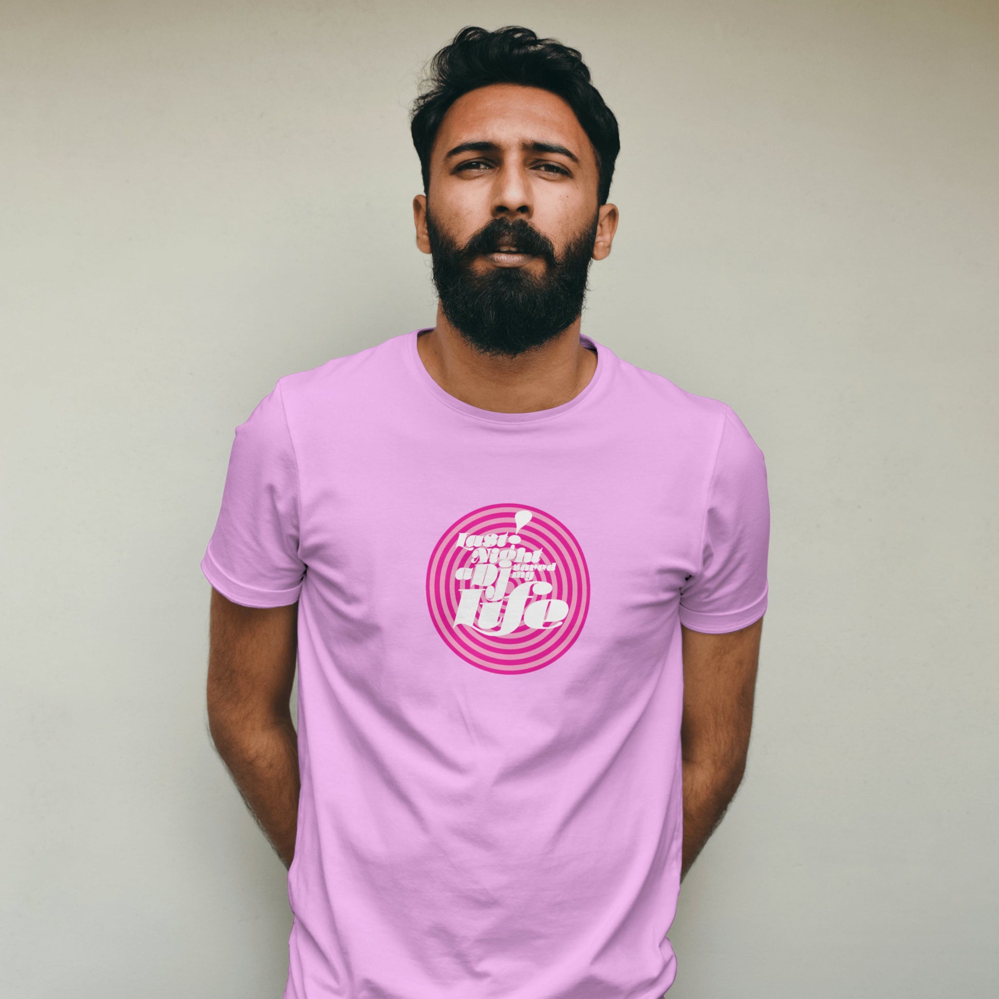 Man wearing a pink t-shirt with DJ Saved My Life Print against a plain background