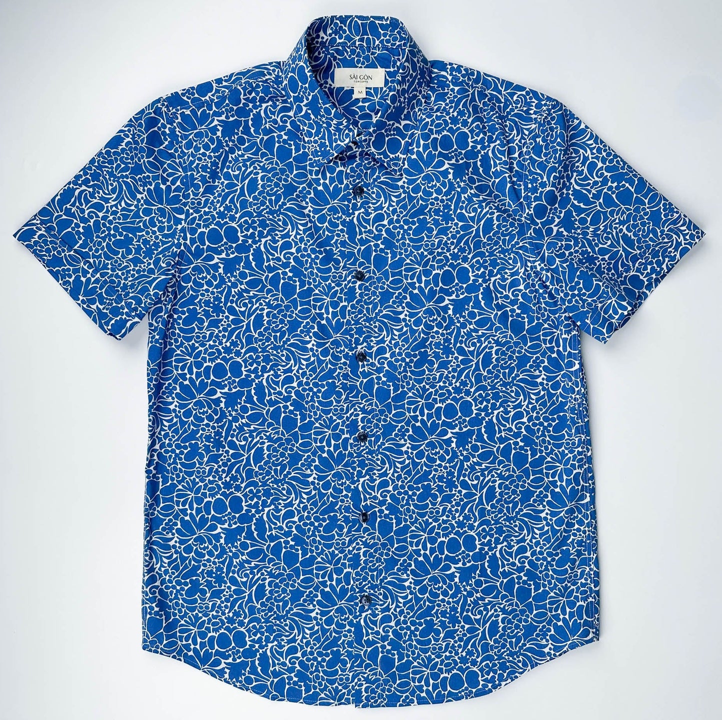 Monet Blue short sleeve button-up shirt lay flat full front view, blue floral print with white linework
