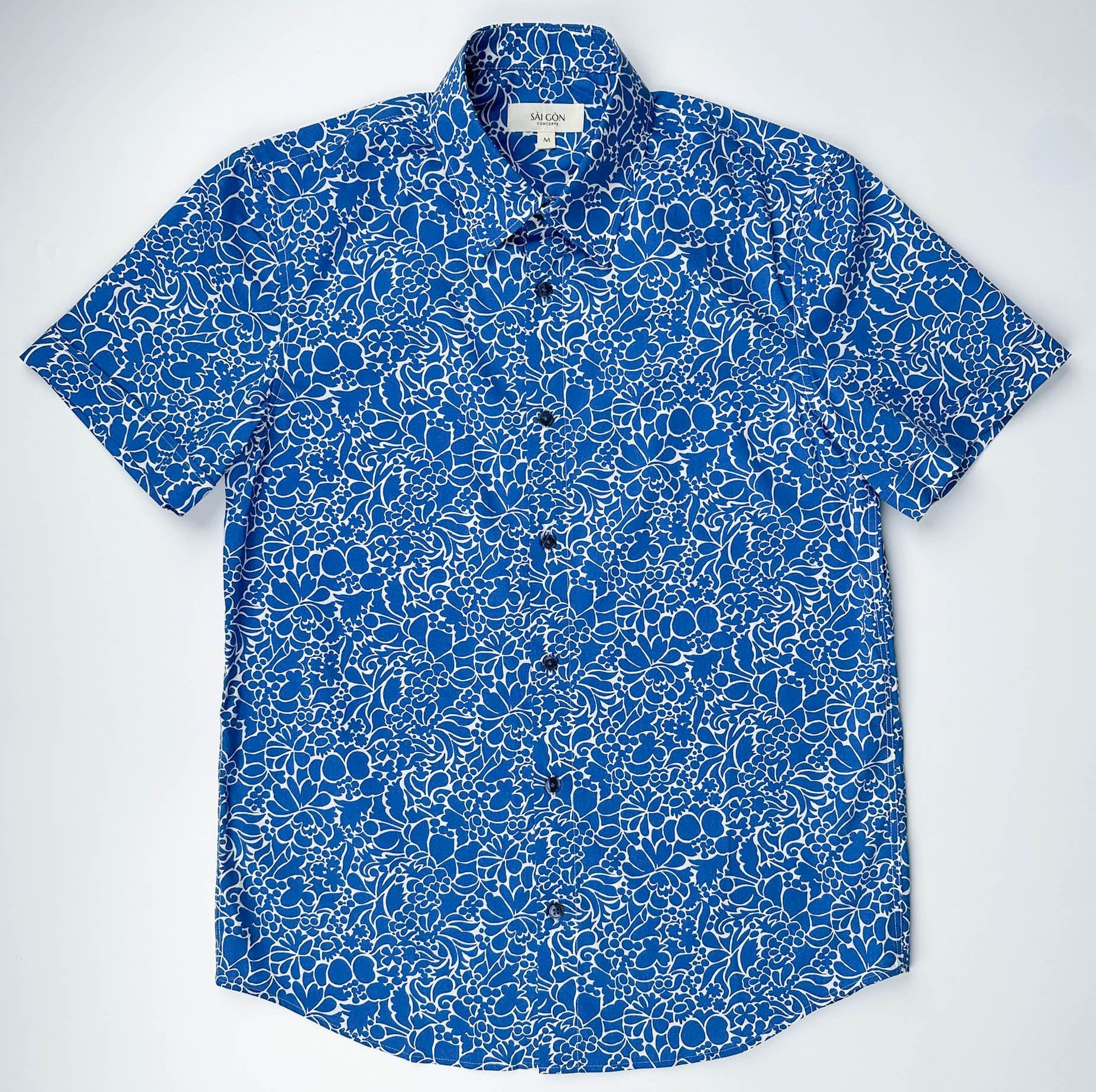Monet Blue short sleeve button-up shirt lay flat full front view, blue floral print with white linework