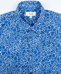 Monet Blue short sleeve button-up shirt lay flat neck collar view, blue floral print with white linework