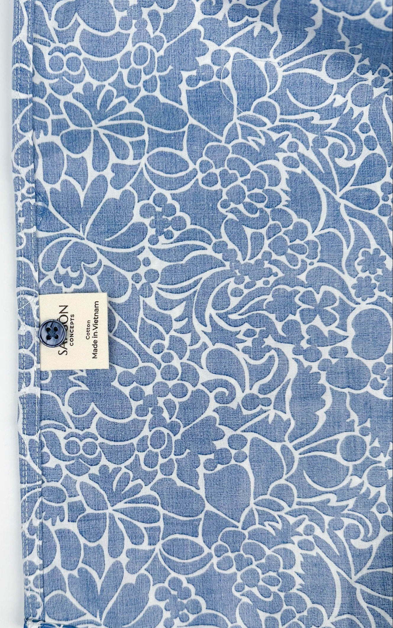 Monet Blue short sleeve button-up shirt lay flat inside care label view