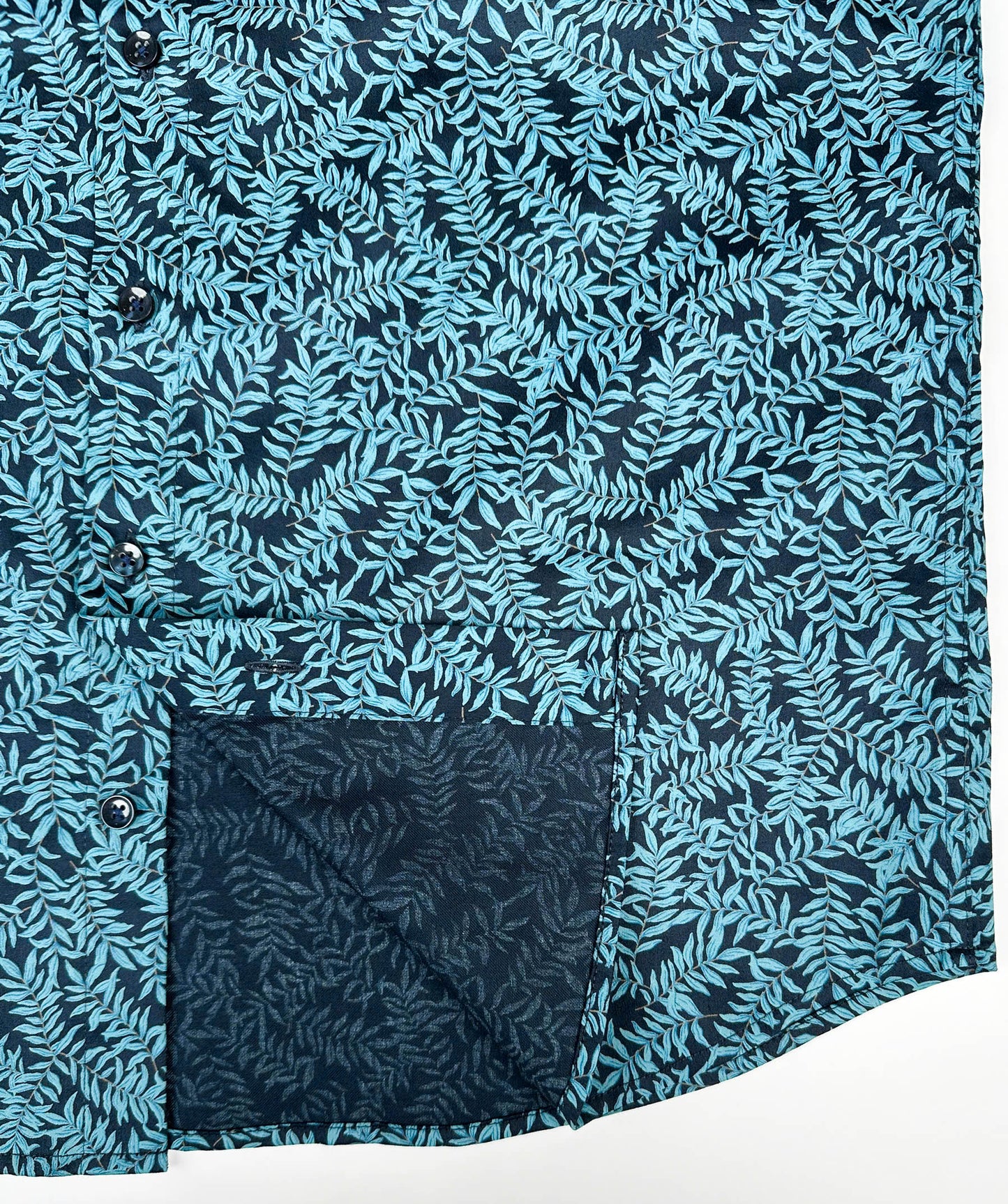 Mossy Leaf cotton short sleeve button-up shirt, teal blue leaf print on navy, inside edge lay flat view