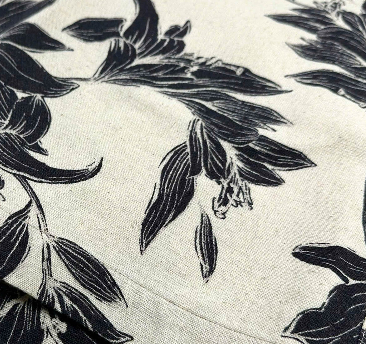 Beige linen-cotton shirt with black lily floral pattern 
