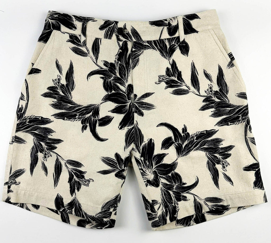 Beige linen-cotton shorts with black lily floral pattern 
