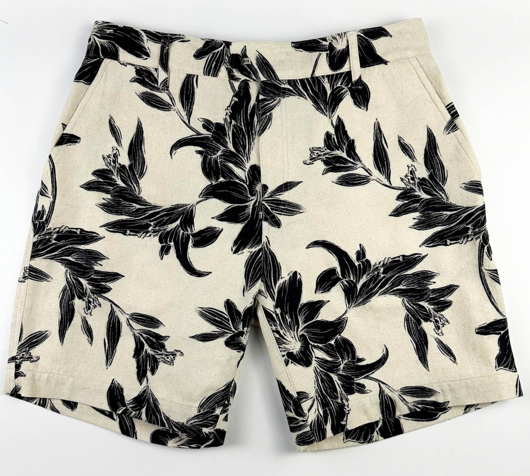 Beige linen-cotton shorts with black lily floral pattern 
