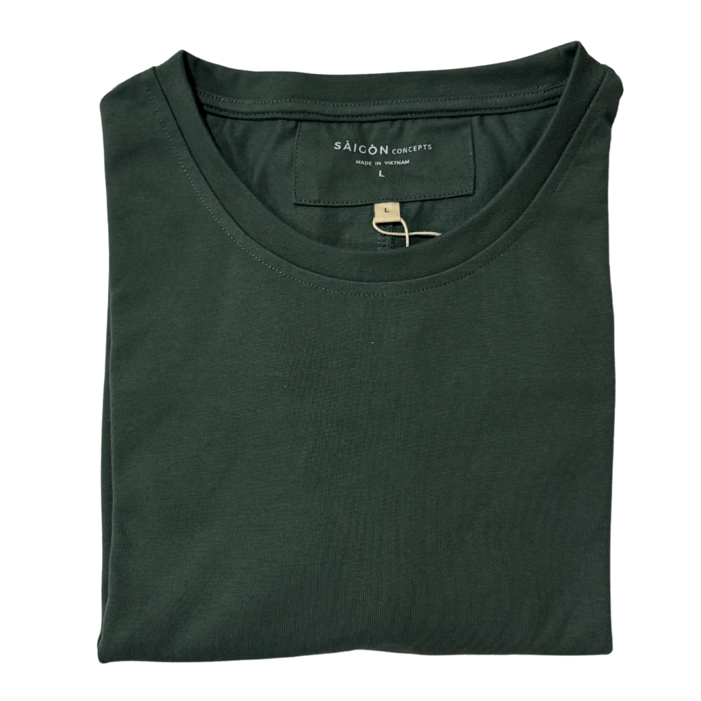 Folded jungle green t-shirt with 'Saigon Concepts' label on a white background
