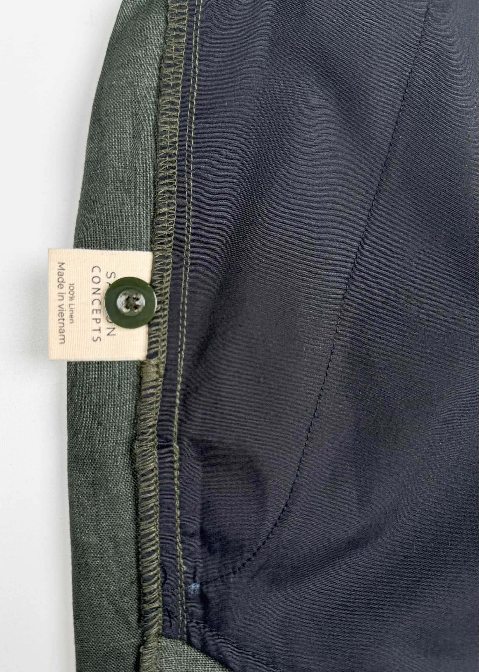 Deep Army Green Linen Shorts - inside care label and spare button detail - Saigon Concepts