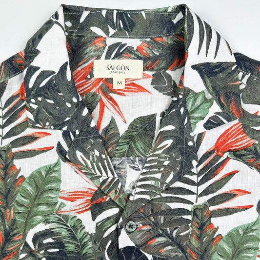 Saigon Concepts Fire & Fern Hawaiian Shirt - tropical jungle print with monstera ferns and bird of paradise florals on natural white linen - front collar detail view