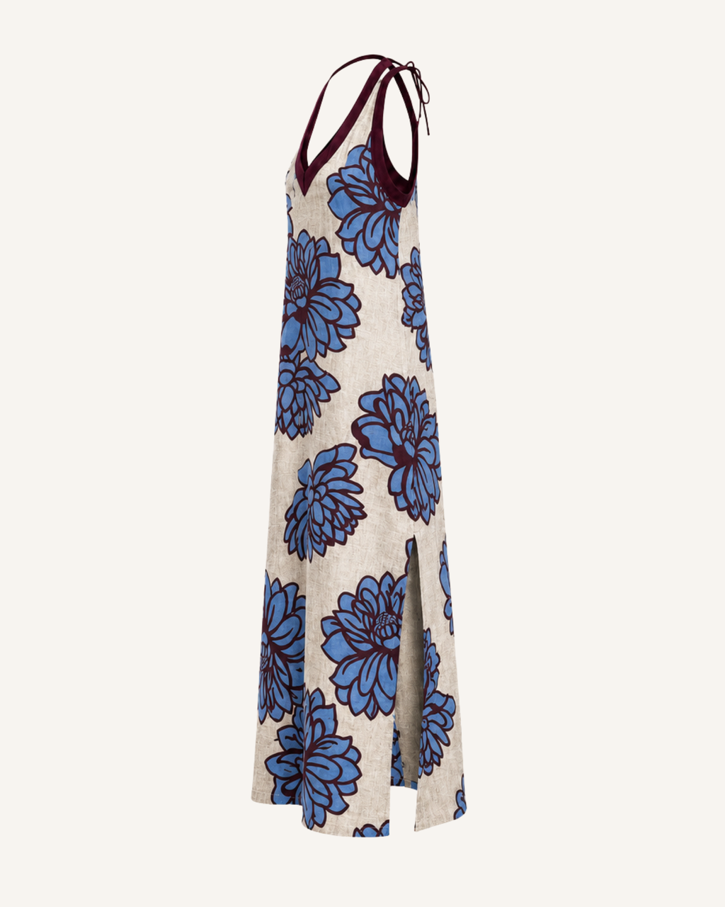 Ghost mannequin side view of a cream halter dress with a blue floral print