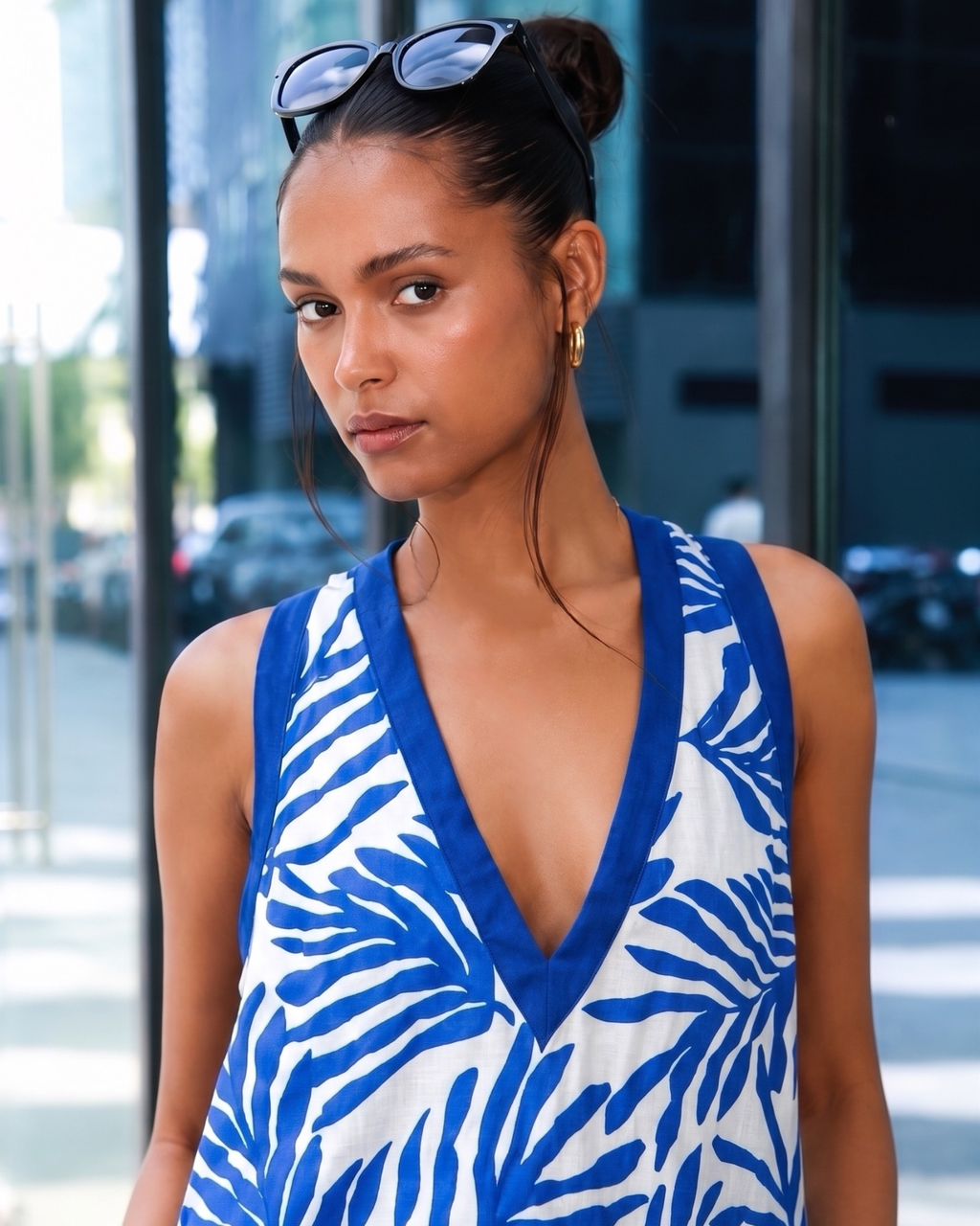 Close-up of a woman wearing a blue and white patterned dress