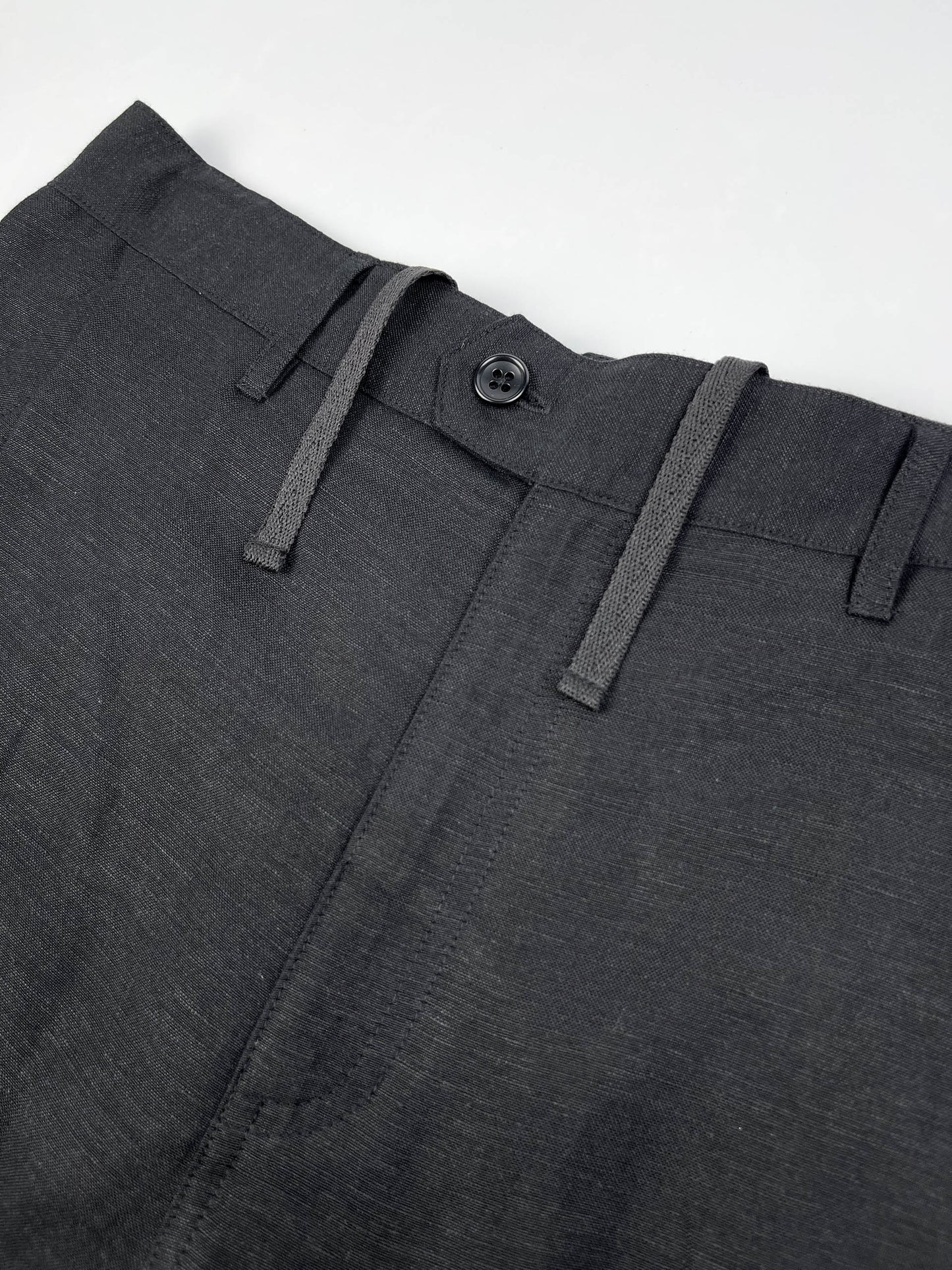 Men's black linen cotton pants with pleated front and elastic back waistband by Saigon Concepts - front waistband view