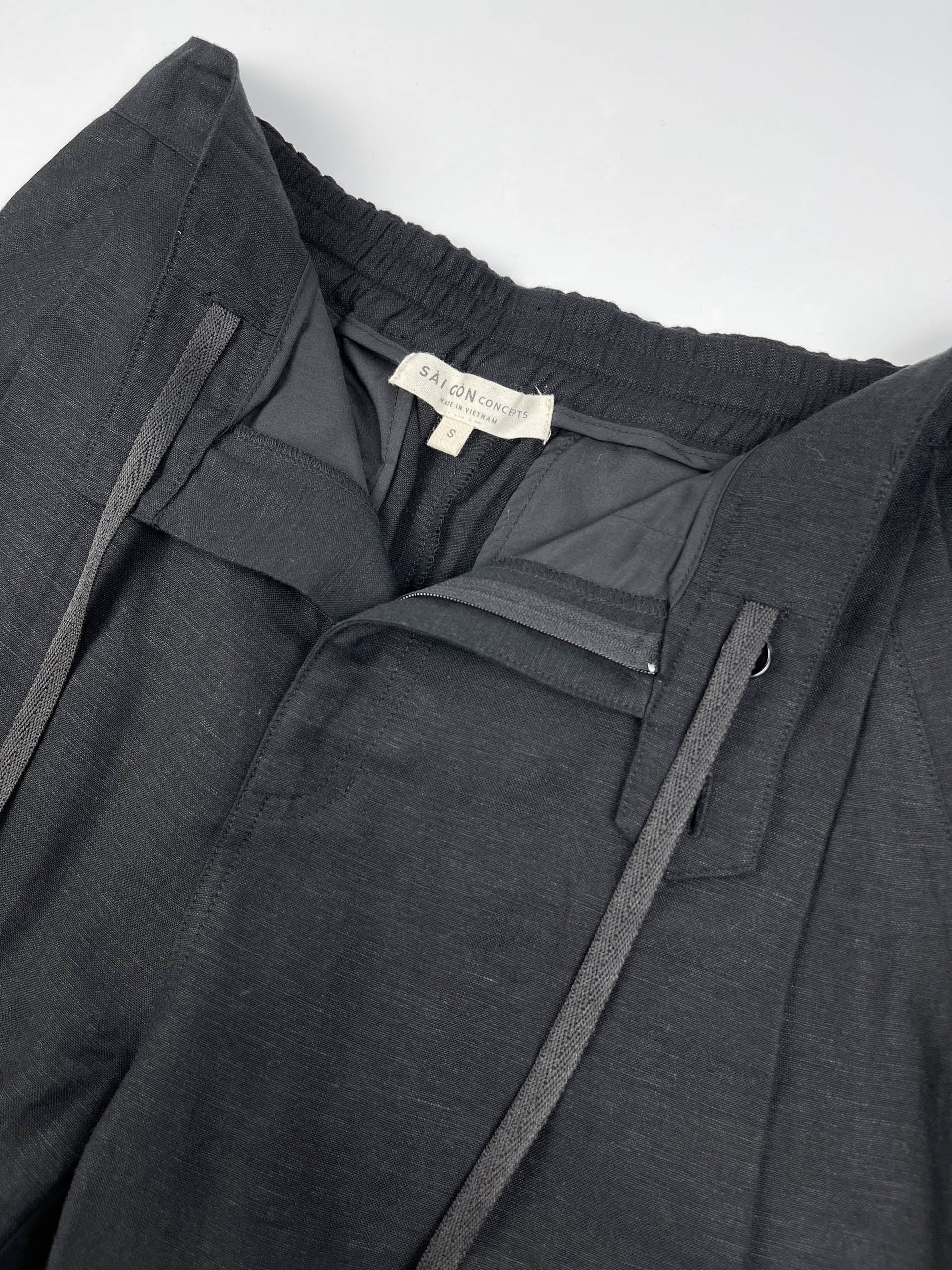 Men's black linen cotton pants with pleated front and elastic back waistband by Saigon Concepts 