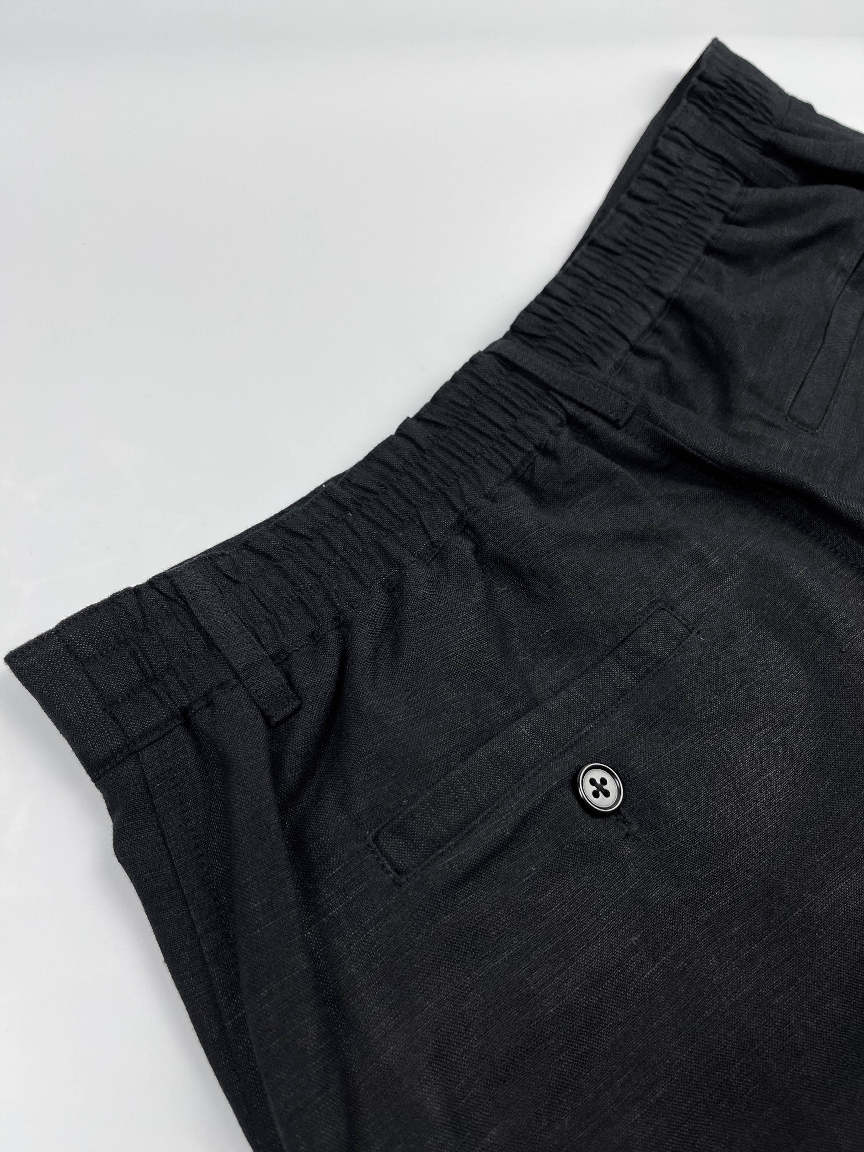 Saigon Concepts Black Linen Riviera Shorts - elasticated back waistband and back pocket detail veiw