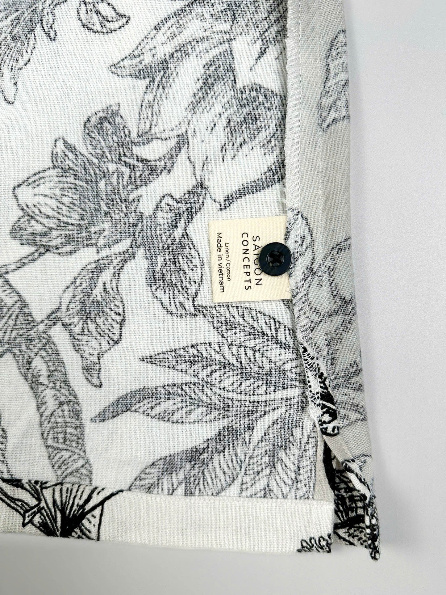 Short sleeve cotton-linen pyjama top with botanical print and button front - care label and spare button detail