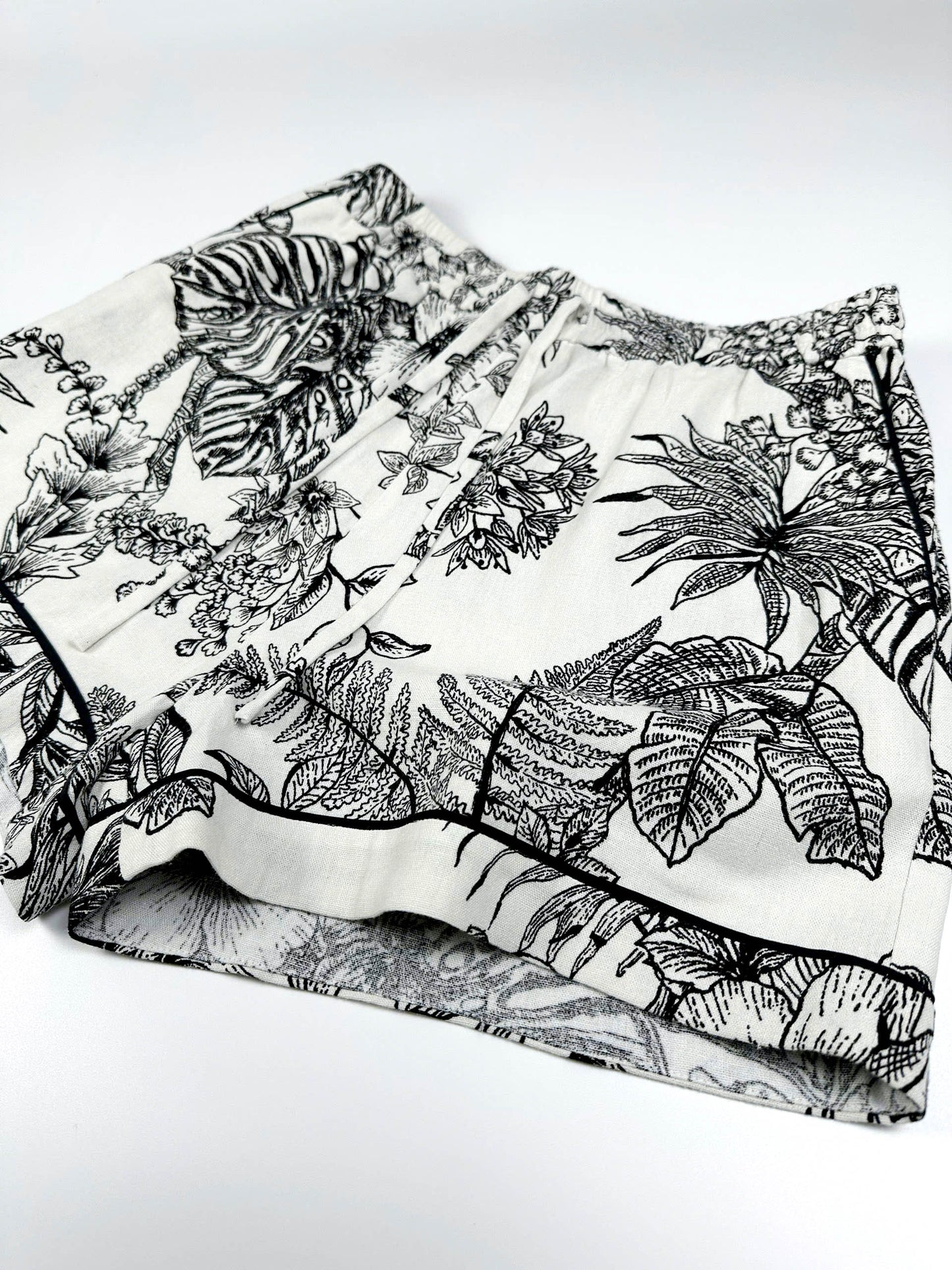 Saigon Concepts Short sleeve cotton-linen pyjama shorts with botanical print and contrasting trim  - side detail view